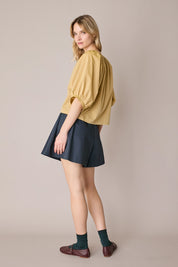 Top con bottoni rivestiti