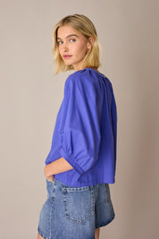 Top con bottoni rivestiti