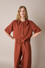 Ruffled polo top