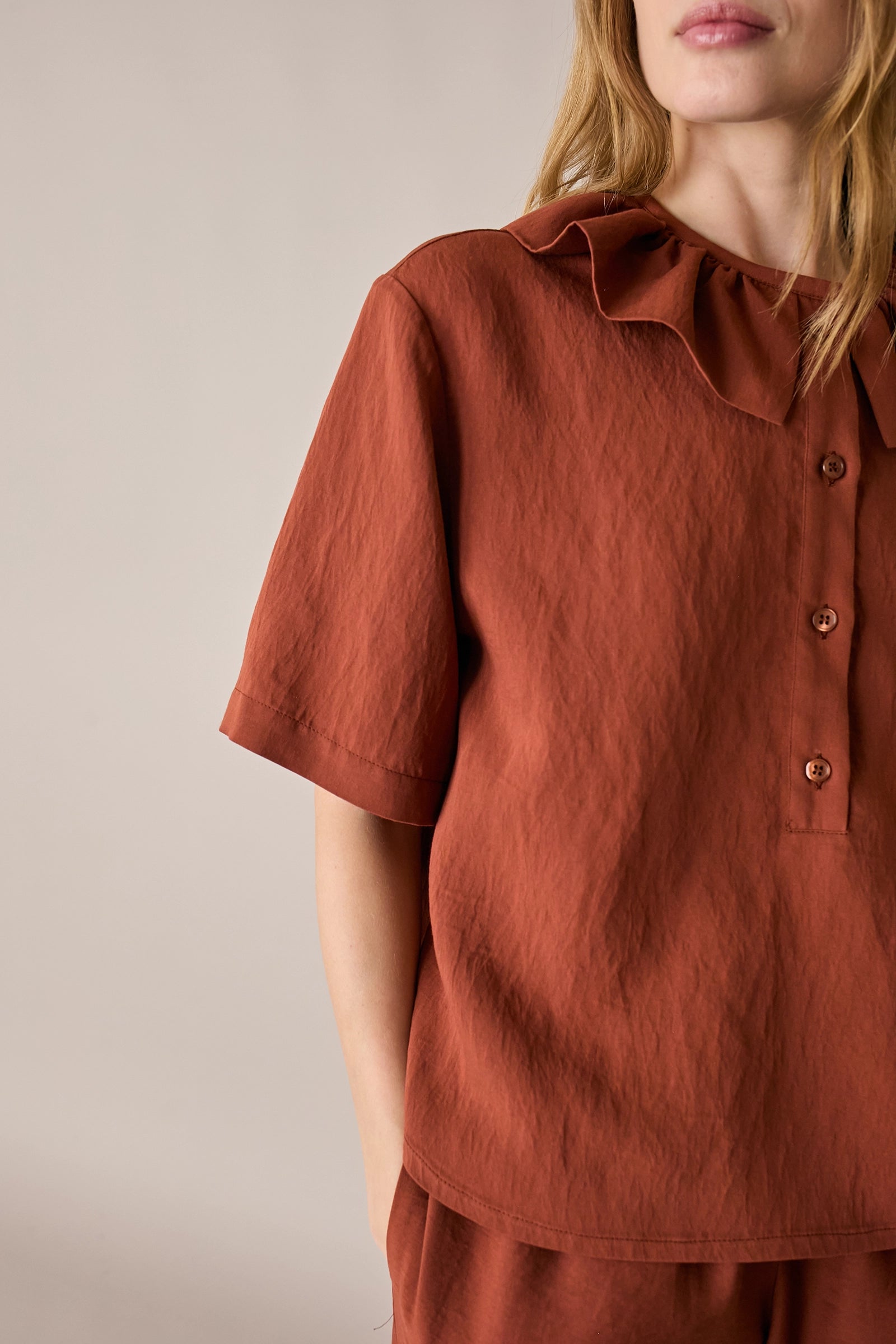Ruffled polo top