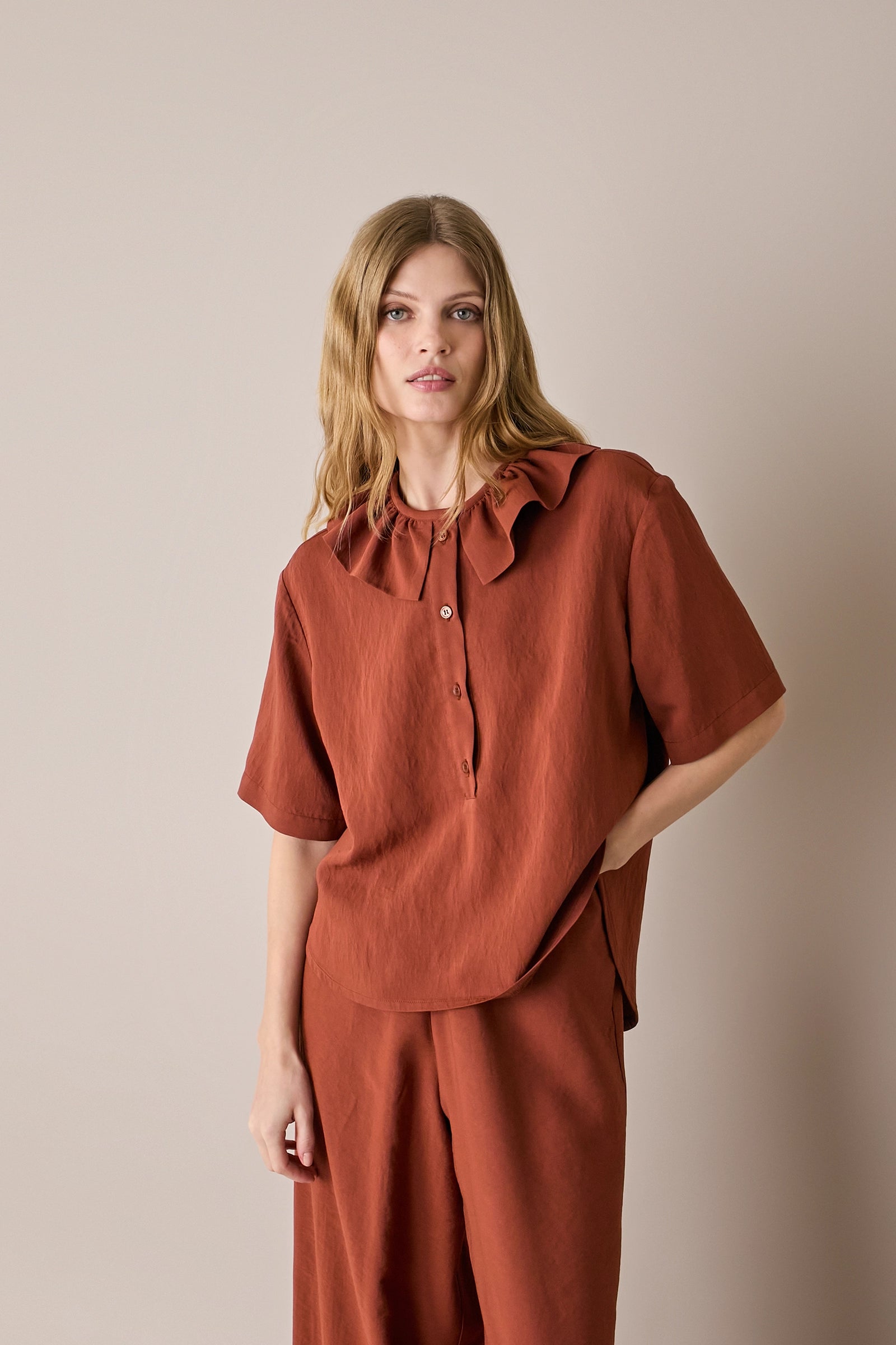 Ruffled polo top