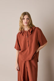 Ruffled polo top