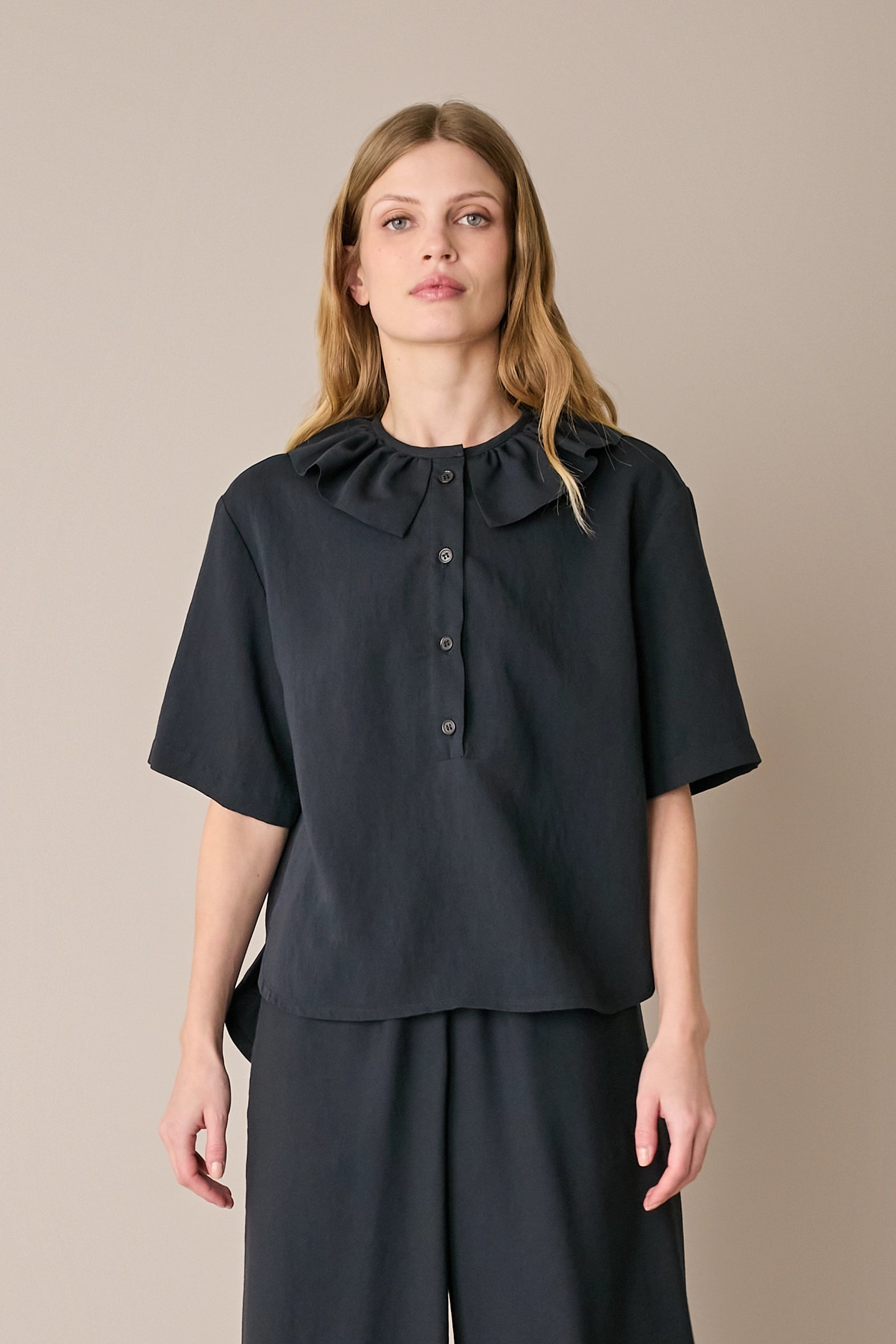 Ruffled polo top