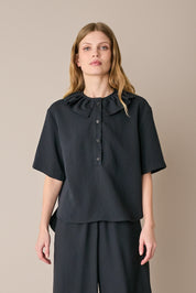 Ruffled polo top