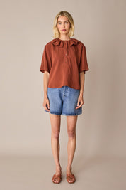 Ruffled polo top