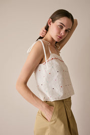 Top con pois ricamati