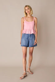 Top in lino con balza