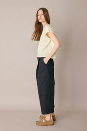 Pantaloni in cotone con piega e risvolto