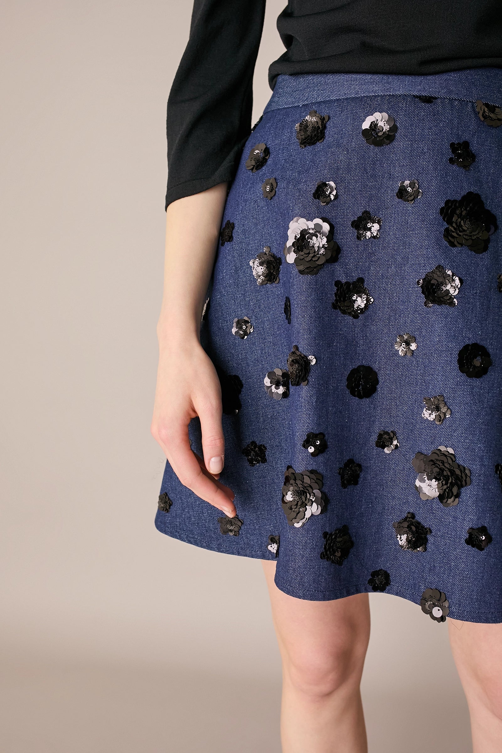 Denim skirt with sequin flowers