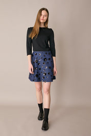 Denim skirt with sequin flowers