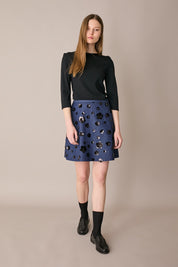 Denim skirt with sequin flowers