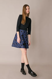 Denim skirt with sequin flowers
