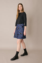 Denim skirt with sequin flowers