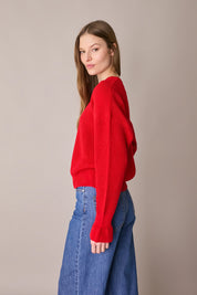 Maglia punto pannocchia con polsini volant