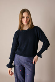 Maglia punto pannocchia con polsini volant