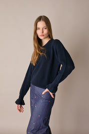 Maglia punto pannocchia con polsini volant