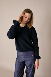 Maglia punto pannocchia con polsini volant